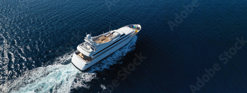 Aerial drone ultra wide panoramic photo of luxury yacht with wooden deck anchored in Mediterranean seascape © aerial-drone