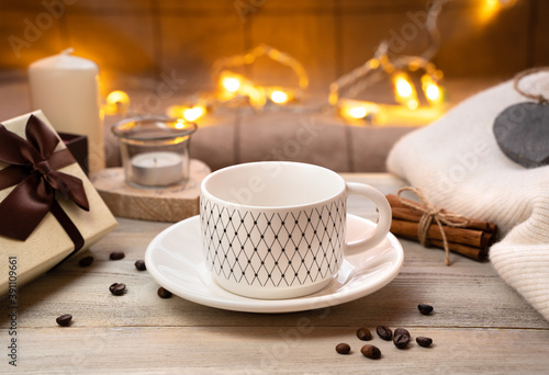 Empty white Cup on a saucer on a festive background. Side view. Concept of holiday backgrounds.