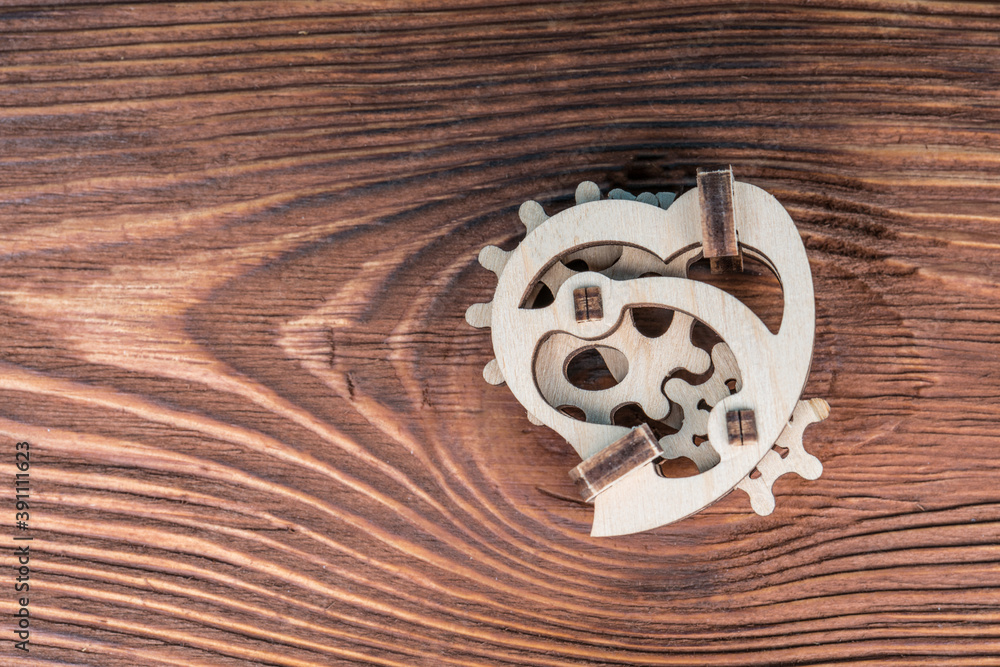 Mechanical heart and gears. made of natural wood