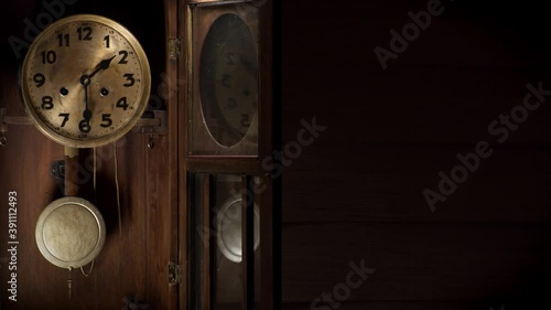 Old wooden clock measuring the time

