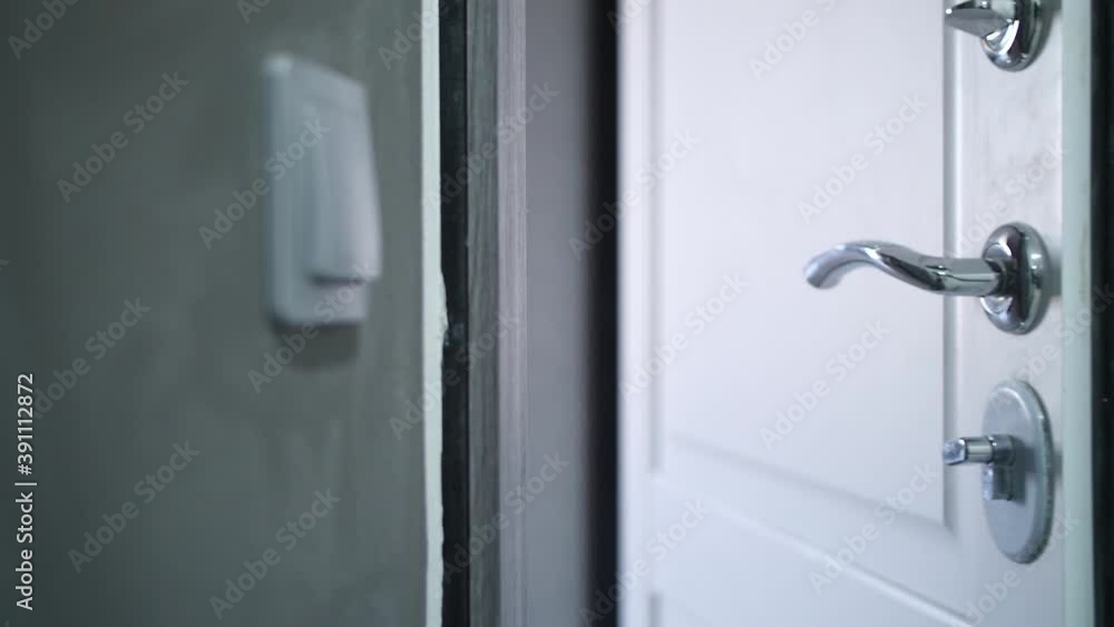 a man opens the front door a man opens the front door