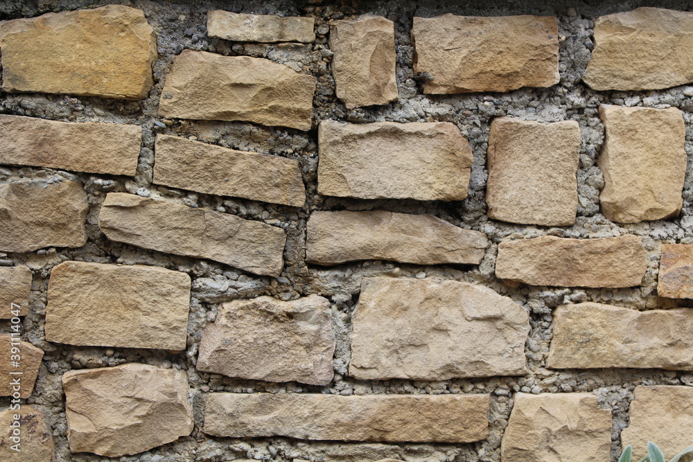 Fototapeta premium Unregelmäßige Natursteinmauer
