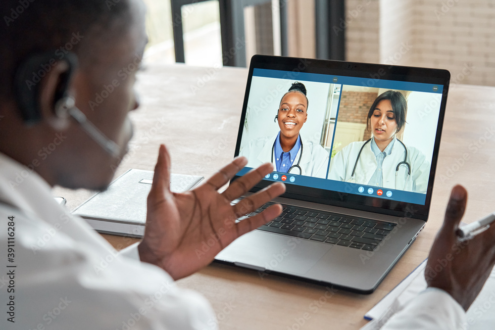 Multicultural doctors team conferencing in video call chat discussing health care learning online during web seminar. Group medical webinar training, healthcare elearning videoconference concept. Multicultural doctors team conferencing in video call chat discussing health care learning online during web seminar. Group medical webinar training, healthcare elearning videoconference concept.
