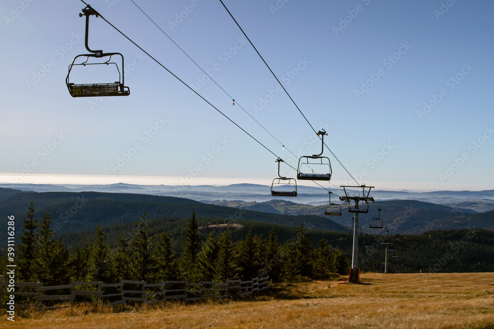 SPINDLERUV MLYN, CZECH REPUBLIC . Chairlift with a mountain landscape of the mountains. Famous ski resort in Czech Rupublic - Spindleruv Mlyn. Recreation, leisure outdoor activities. Tourism in Czech 