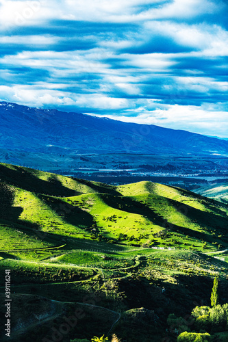 Green valley with a mountain lake