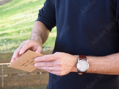 Man opening nice letter 