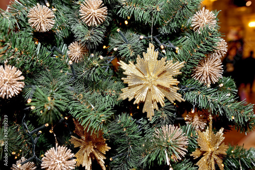 Christmas decorations in the form of snowflakes on the New Year and Christmas tree