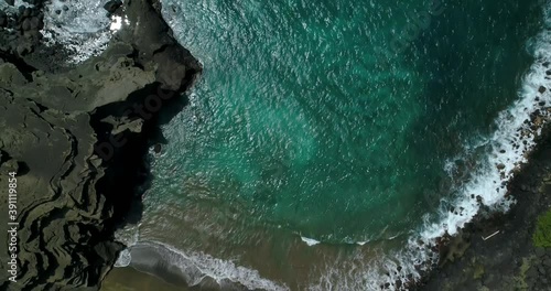 4K  backward tracking directly above aerial view of Papakolea Green Sand beach on Big Island,Hawaii,usa photo