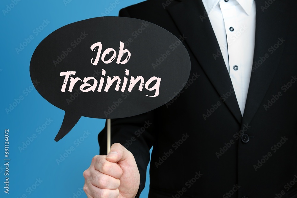 Job Training. Businessman holds speech bubble in his hand. Handwritten Word/Text on sign. Job Training. Businessman holds speech bubble in his hand. Handwritten Word/Text on sign.