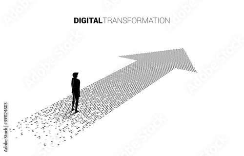 Silhouette of businessman standing on the arrow from pixel. concept of digital transformation of business.