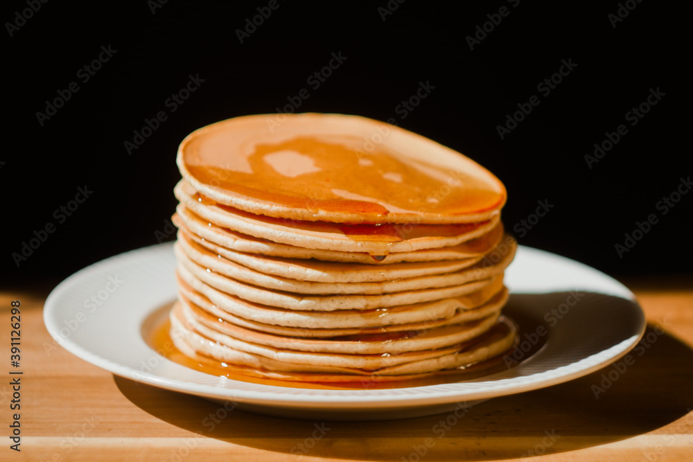 Close up tasty stack pancakes with maple syrup. Sweet dessert for breakfast. Close up tasty stack pancakes with maple syrup. Sweet dessert for breakfast.