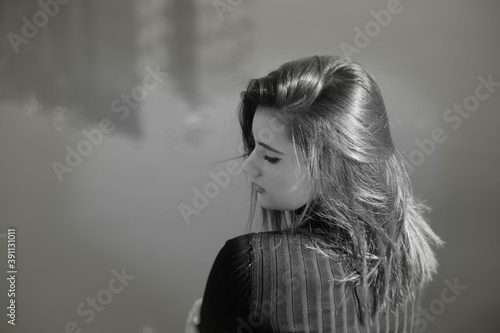 Portrait of a beautiful young woman in black and white