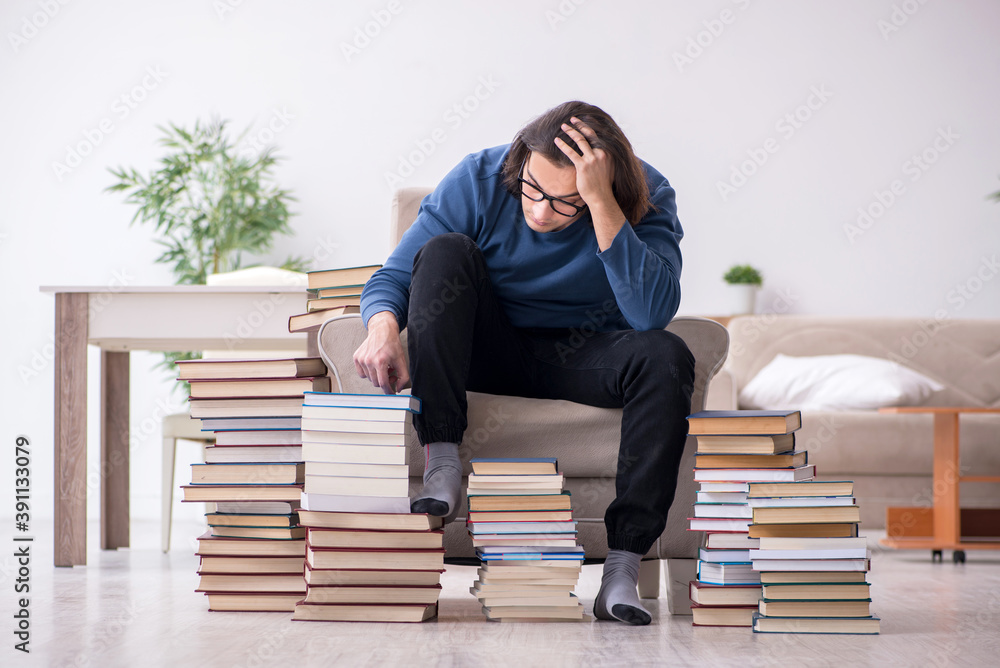 Young male student preparing for exams at home Young male student preparing for exams at home