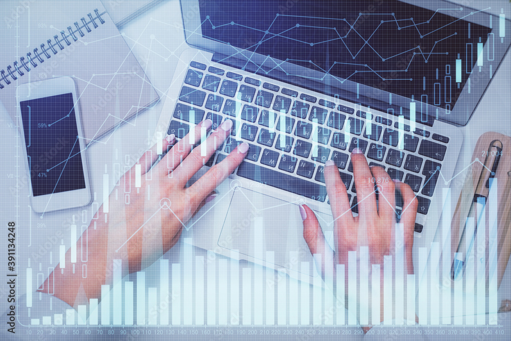 Double exposure of woman hands working on computer and forex graph hologram drawing. Top View. Financial analysis concept. Double exposure of woman hands working on computer and forex graph hologram drawing. Top View. Financial analysis concept.
