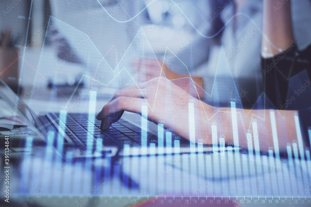 Multi exposure of woman hands typing on computer and financial graph hologram drawing. Stock market analysis concept. Multi exposure of woman hands typing on computer and financial graph hologram drawing. Stock market analysis concept.