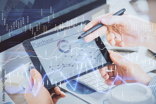 Double exposure of man's hands holding and using a phone and financial chart drawing. Market analysis concept.