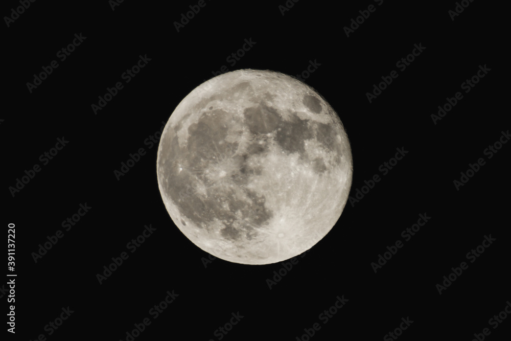 Earth's Moon Glowing On Black Background Earth's Moon Glowing On Black Background