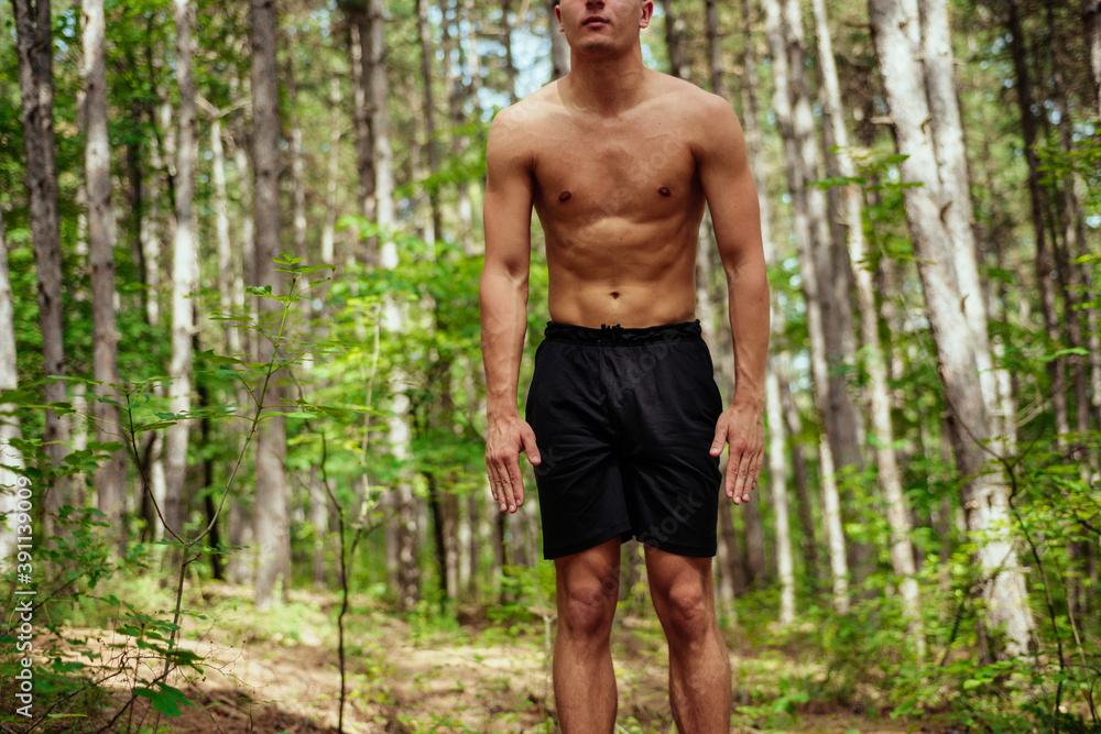 Fitness exercise. athletic active man with fit muscular body stretching, exercising before running Fitness exercise. athletic active man with fit muscular body stretching, exercising before running