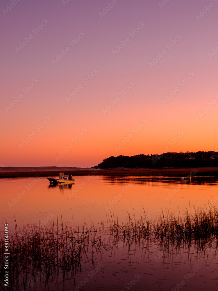 Sunset Silhouette Seascape with Moored Boat in the Tranquil Bay