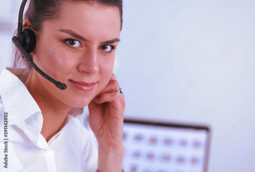 Close-up portrait of a customer service agent sitting at office Close-up portrait of a customer service agent sitting at office