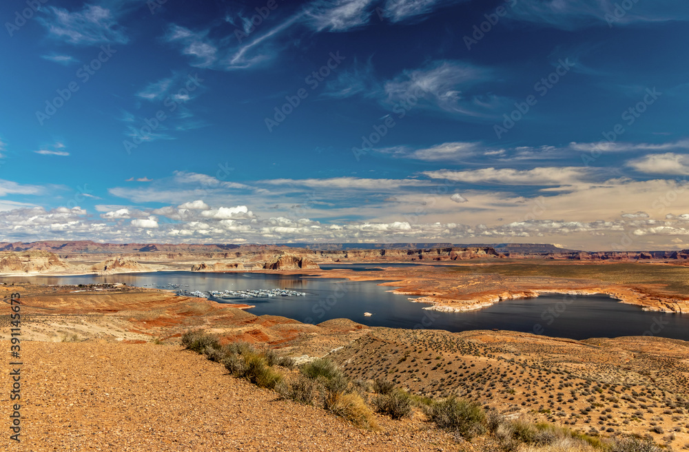 Spectacular patterns of clouds on the blue sky over the river and the marina, Wahweap lookout, Page, AZ
