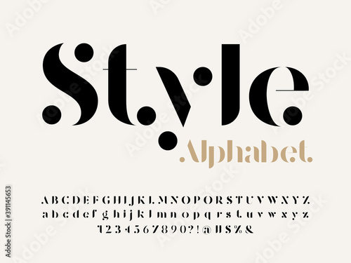 Modern serif alphabet design with uppercase, lowercase, numbers and symbol photo