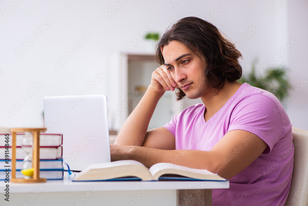 Male student in love preparing for exams in time management conc Male student in love preparing for exams in time management conc