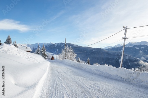 Mountain road in winter snowy village