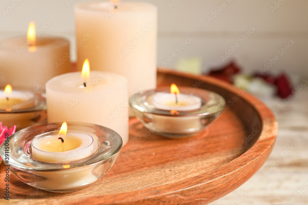 Burning candles for celebration of Divaly on tray, closeup Burning candles for celebration of Divaly on tray, closeup