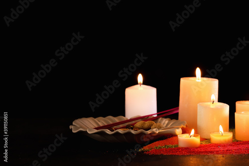 Burning candles for celebration of Divaly on dark background