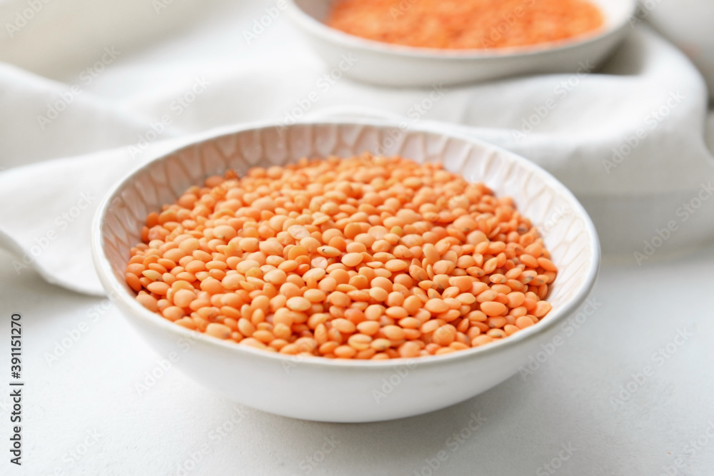 Bowl with raw lentils on light table Bowl with raw lentils on light table
