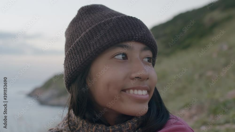 Medium close up of Asian girl smile and happy enjoying sea beautiful, Asia child Wear a Wool hat in winter Medium close up of Asian girl smile and happy enjoying sea beautiful, Asia child Wear a Wool hat in winter