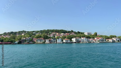 Footage of Istinye / Yenikoy area of Istanbul by Bosphorus strait. Beautiful scene. It is a sunny summer day. Camera moves forward. photo