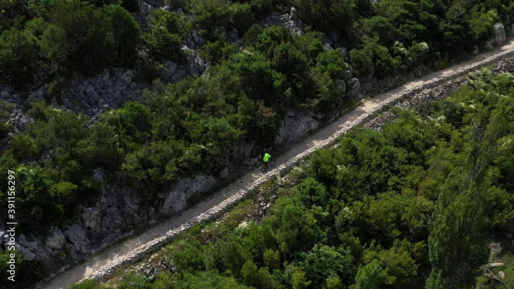 Bacina Lakes Bike Trail - Biker Cycling On The Trail In Dalmatia, Croatia On A Sunny Day - aerial Bacina Lakes Bike Trail - Biker Cycling On The Trail In Dalmatia, Croatia On A Sunny Day - aerial