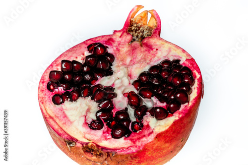 Close-up of pomegranate fruit with infinity white background