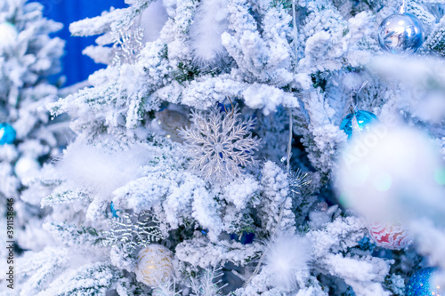 Christmas decorations. Decorative snowflakes on white Christmas trees