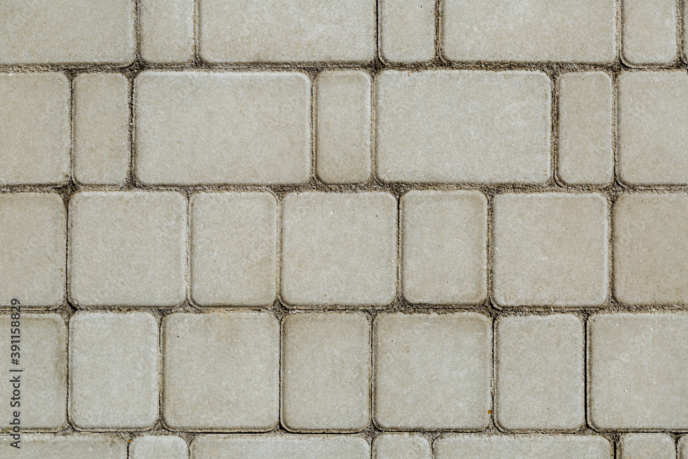 Concrete or cobble gray square pavement slabs or stones for floor, wall or path. Traditional fence, court, backyard or road paving. Concrete or cobble gray square pavement slabs or stones for floor, wall or path. Traditional fence, court, backyard or road paving.