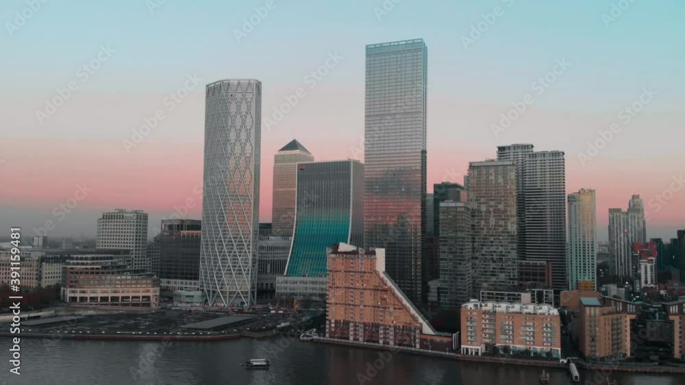 Rising Drone aerial shot of London Canary Wharf at sunset Rising Drone aerial shot of London Canary Wharf at sunset