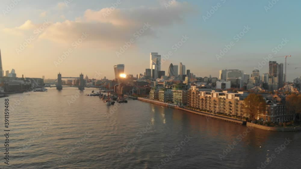slider drone shot over London Thames river towards city centre over residential building sunset slider drone shot over London Thames river towards city centre over residential building sunset