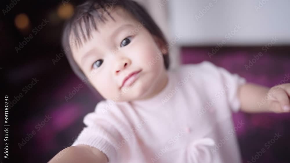 Asian happy infant little girl smiling while looking walking toward camera, family warmness, toddler first step, children learning skills, little girl learn how to walk by herself, pure innocence Asian happy infant little girl smiling while looking walking toward camera, family warmness, toddler first step, children learning skills, little girl learn how to walk by herself, pure innocence