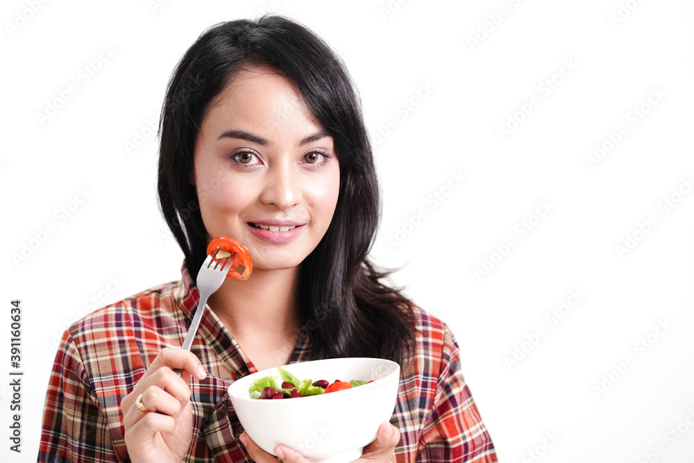 Asian healthy woman eating clean salad food isolated on white background. Asian healthy woman eating clean salad food isolated on white background.