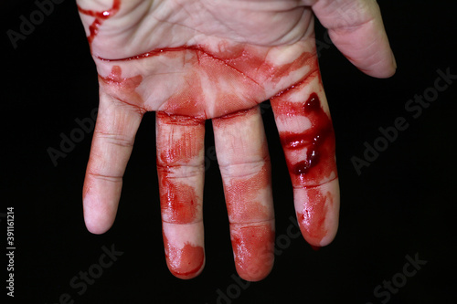 Fotografie, Obraz Close up hand injury, Finger cut with knife, real bloody hand