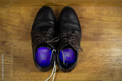 Electric ultraviolet Shoe dryer. Shoe care.