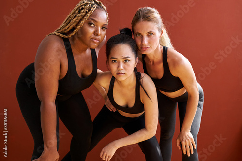 ethnic beauty women three black and white skin healthy and beautiful models isolated in studio  beautiful females in black sportswear posing  people diversity and tolerance concept