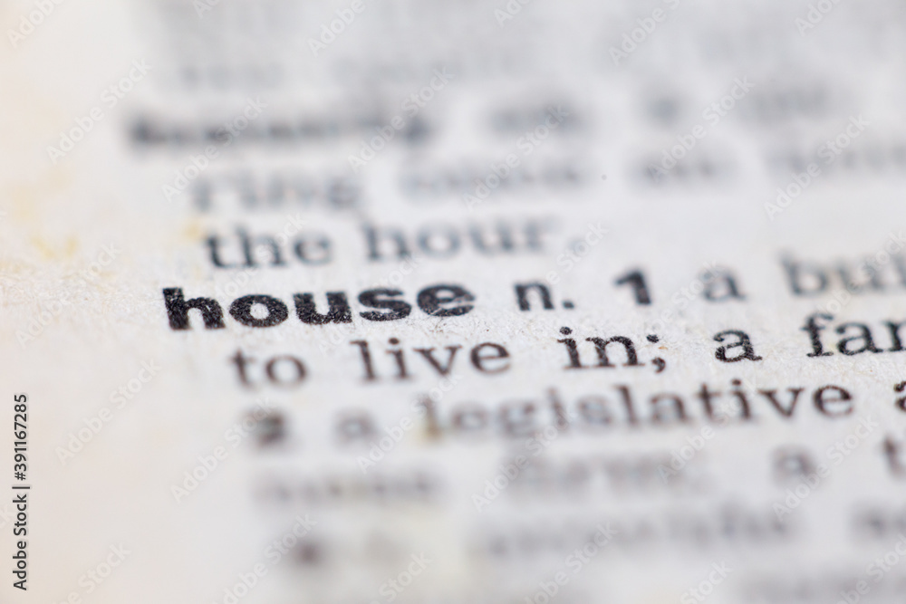 Macro close up of old English dictionary page with word house
Macro close up of old English dictionary page with word house