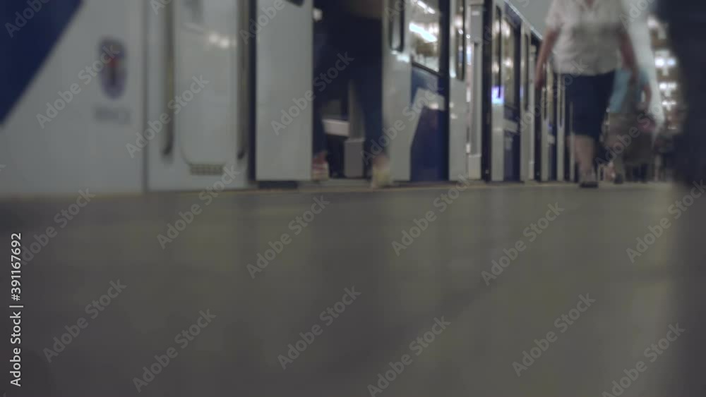 Modern metro train arrives at subway station and departures. Timelapse. People are waiting for arrival of carriages at underground. Passengers get out and boarding a coaches. Public transportation Modern metro train arrives at subway station and departures. Timelapse. People are waiting for arrival of carriages at underground. Passengers get out and boarding a coaches. Public transportation