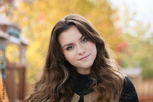 Close up Portrait of 18 Years Old Beautiful, Gorgeous Girl with Long Brown hair and Big eyes, Blurry Fall Background, Happy Teenager 