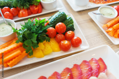 Fresh vegetables cut into strips with sauce and herbs are a treat for guests of the event