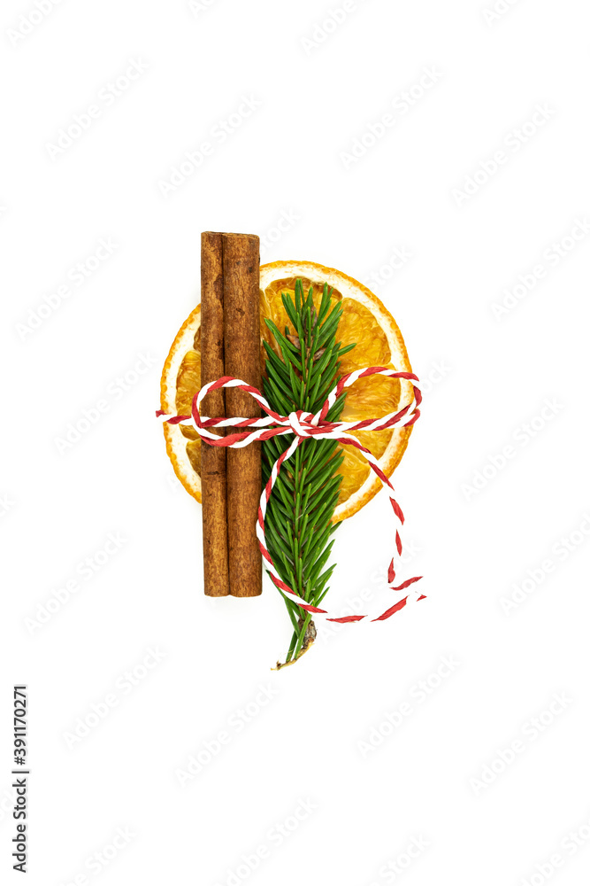 Christmas composition with dried oranges, cinnamon, fur tree branches and packing string on white background. Christmas decor for home. Flat lay with copy space