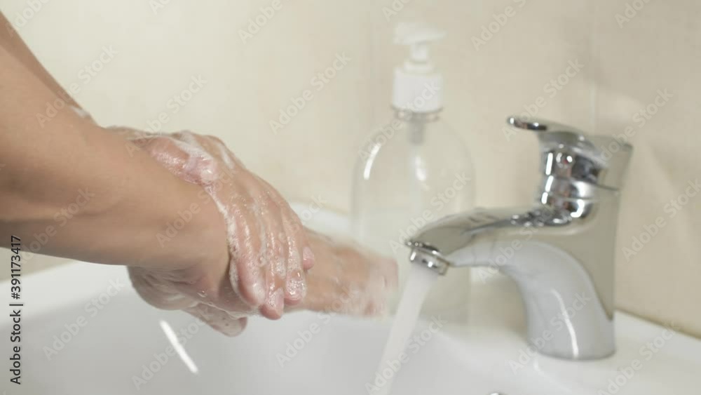 Man washing hands with sanitizer gel soap, prevention coronavirus Covid-19 virus Man washing hands with sanitizer gel soap, prevention coronavirus Covid-19 virus